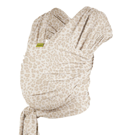 A Boba Classic Baby Wrap, made from a soft 95% French Terry cotton blend and 5% Spandex. Ergonomic, award-winning design fits babies from 7 Ibs to 35 Ibs, best up to 20 Ibs. Machine washable, dryer friendly, and certified hip-healthy. Sand Leopard